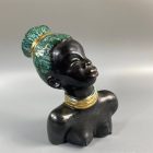 Mid-century African-American female head with turquoise hair by Margit Izsépy 