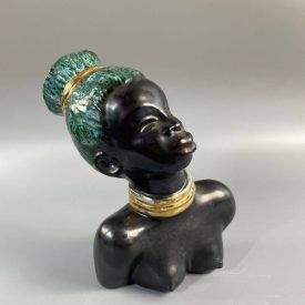   Mid-century African-American female head with turquoise hair by Margit Izsépy 