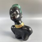 Mid-century African-American female head with turquoise hair by Margit Izsépy 