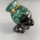 Mid-century African-American female head with turquoise hair by Margit Izsépy 