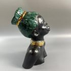 Mid-century African-American female head with turquoise hair by Margit Izsépy 
