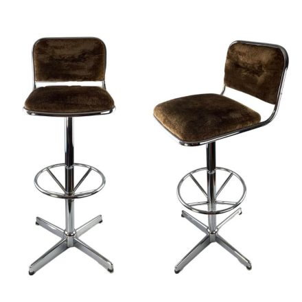 A pair of chrome swivel bar stools from the 70s