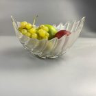 Retro fruit bowl with palm leaves