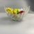 Retro fruit bowl with palm leaves